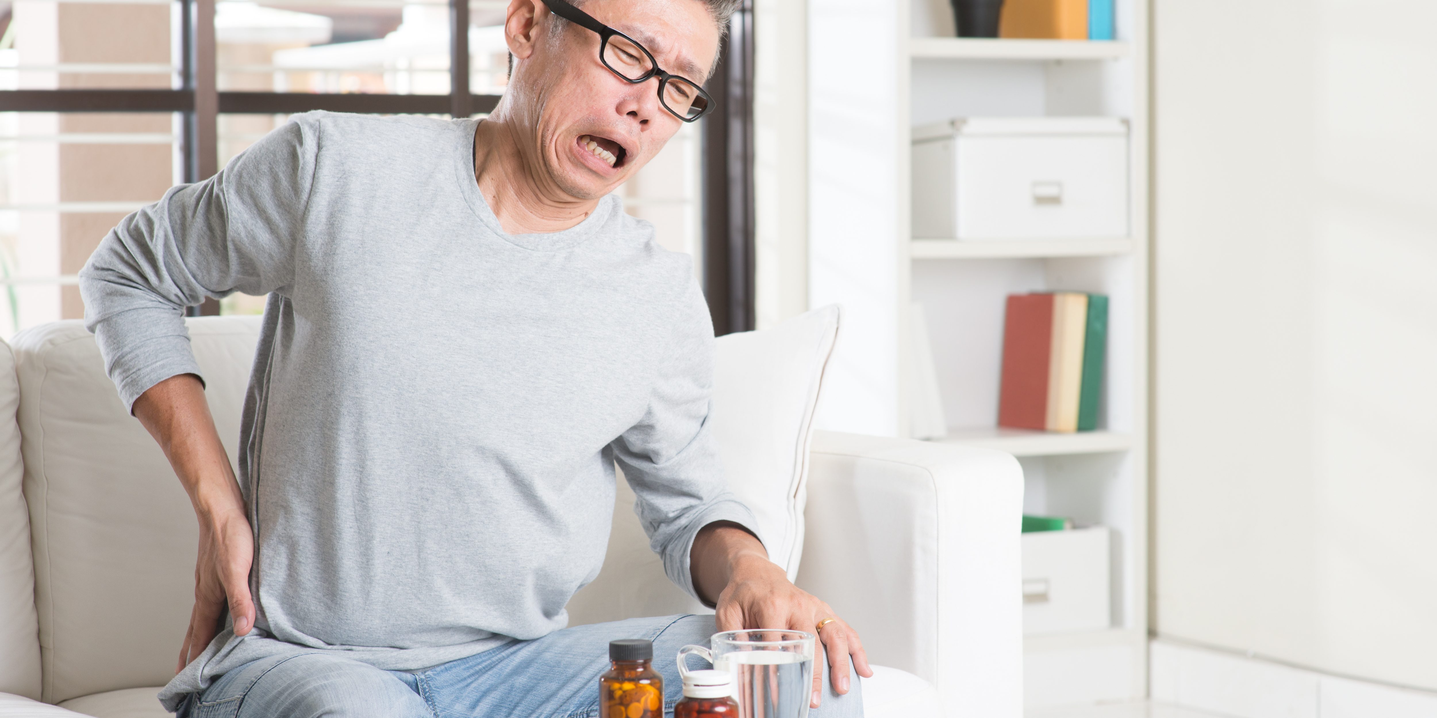 Mature Asian man hip pain